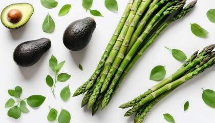Wall Mural - Green herbs, asparagus and black avocado on a white background