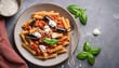 © Lupu - Pasta penne with eggplant. Pasta alla norma - traditional Italian food with eggplant, tomato, ricotta cheese and basil