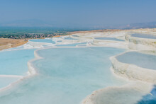Stunning Turquoise Travertine Pools In The White Landscape Of Pamukkale, In Turkiye