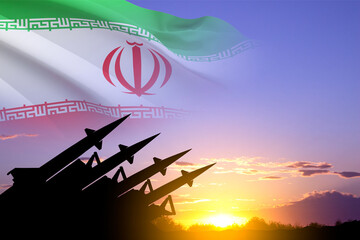 Wall Mural - Missiles silhouettes with Iran flag against the sunset