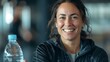 © Irina Ukrainets - Smiling woman resting at gym with water bottle, casual fitness lifestyle portrait, joyful break concept. AI