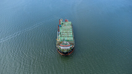 Aerial view of a large ship carrying containers in the Kalimantan sea, shipping containers, inter island trade