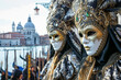 People are dressed up for the Venice Carnival in Italy