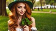 © Mariana - ginger girl with hat St. Patrick's Day on park background