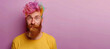 Surrealistic Style: Expressive Bearded Man with Colorful Curls. man with a beard, incredible colored curls in his hair. minimalistic pastel purple background. creative barber with an original style.