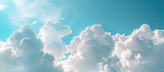 Wall Mural - A plane soars through a blue sky dotted with fluffy white clouds. The aircrafts wings are visible as it travels through the vast expanse of the atmosphere.