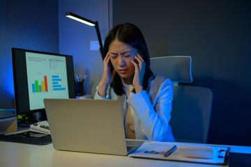 Poster - Stressed and overworked businesswoman working overtime at night, having headache and exhausted.