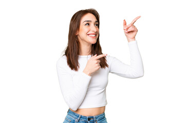 Wall Mural - Young caucasian woman over isolated chroma key background pointing with the index finger a great idea