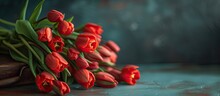 A Bouquet Of Vibrant Red Tulips Displayed On A Rustic Vintage Table. The Tulips Stand Tall And Proud, Adding A Splash Of Color To The Space.