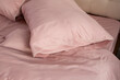 pink cotton bed linen pillows close up