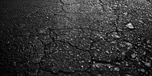Textured Asphalt Surface With Copy Space. A Detailed Black Close-up Texture Of Asphalt, Rough Surface And Granular Composition.