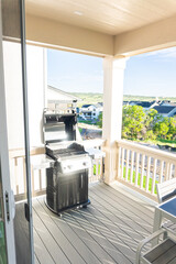 Wall Mural - Brand New Two-Burner Grill Stationed on Balcony