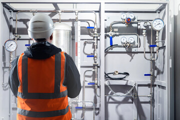 Poster - man engineer. production equipment maintenance specialist. factory engineer in reflective vest. man 