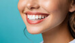 © Shawon - Perfect healthy teeth smile of a young woman. Teeth whitening. Dental clinic patient. Stomatology concept on blue background
