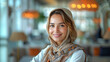 © aekkorn - Smiling a businesswoman of arab descent working on desk in a modern business office tower. bright white tone. bright white tone.
