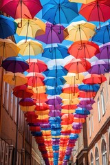 Poster - Colorful umbrellas hanging from the ceiling, perfect for adding a pop of color to any space