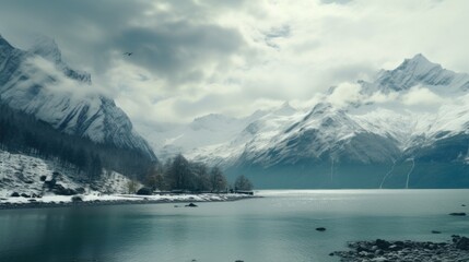 Aufkleber - Scenic view of a snow-covered mountain range reflecting in a tranquil lake. Ideal for travel and nature concepts