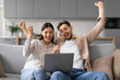 © Prostock-studio - Overjoyed european couple celebrating with laptop, shouting yes
