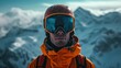 Close up of the ski goggles of a man with the reflection of snowed mountains. A mountain range reflected in the ski mask.