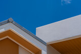 Fototapeta  - facade of a building and roof with blue sky