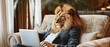 A commanding lion in a designer suit overseeing projects on a laptop in a luxurious corner office