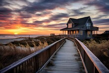 New England Beach House Sunrise On Boardwalk With Sand, Dunes, And Grass