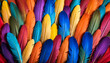 Close-up of bright overlapping feathers showing a variety of shades and textures.