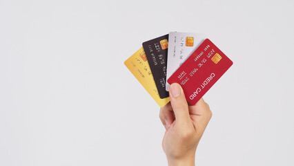 Wall Mural - Hand is hold four credit cards on white background.