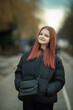 © shymar27 - Portrait of a young beautiful long-haired girl on a spring city street.