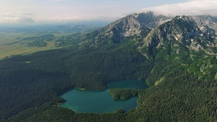 Wall Mural - aerial view of famous black lake in mountain durmitor park at summer, montenegro, 4k