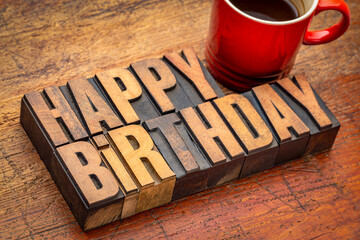Wall Mural - happy birthday greeting card - word abstract in vintage letterpress wood type blocks with a cup of c