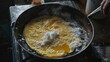 © CinimaticWorks - homemade omlette recipe cooked in a frying pan, a delicious breakfast meal option