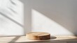 minimalist background with empty natural wooden table counter podium, showcasing beautiful wood grain in sunlight and shadow on white wall, perfect for luxury cosmetic, skincare, beauty treatment