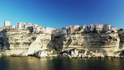 Canvas Print - The houses above the cliffs of Bonifacio, in Europe, in France, in Corsica, towards Ajaccio, by the Mediterranean Sea, in summer, on a sunny day.