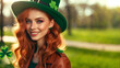 ginger girl with hat St. Patrick's Day on park background