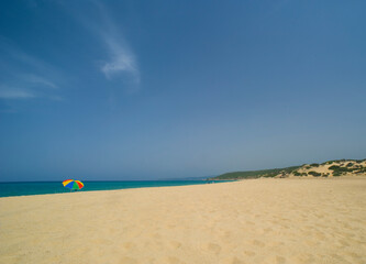 Wall Mural - colourful umbrella at beach and blue sky Piscinas, Sardinia, Italy