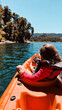 girl sailing kaiak on the lake in summer