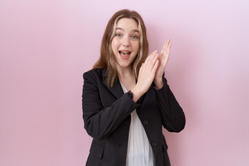 Poster - Young caucasian business woman wearing black jacket clapping and applauding happy and joyful, smiling proud hands together