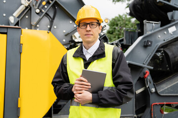 Aufkleber - Engineer with digital tablet next to road construction machine.