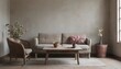 © Antonio Giordano - In a wabi-sabi-style living room with flowers on the table and by the window, sits a beige couch armchair.