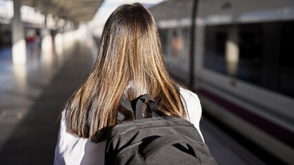 Sticker - Young beautiful hispanic woman going on a trip at train station