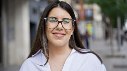 Sticker - Young beautiful hispanic woman wearing glasses smiling happy in the streets of Madrid