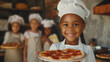 A smiling child dressed as a chef holds out a pizza, children wearing apron stand behind her on restaurant kitchen, African-American girl, pizza workshop for children
