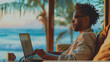 Happy young black man working remotely on a virtual video team meeting call, remote work and flexible culture concept. Digital nomad working by the beach on vacation