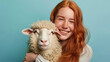 Happy Redhead Girl Wearing Trendy T-Shirt Enjoys Tender Moment with Gentle Sheep