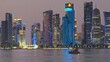 Doha, Qatar skyline at night with dhows and boats  in the Arabic gulf 