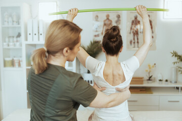 Wall Mural - therapist woman in massage cabinet conducting examination