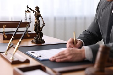 Poster - Notary writing notes at wooden table in office, closeup