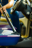 Fototapeta Na sufit - Cleaning car interior with vacuum cleaner