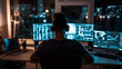 Cyber security concept. Young man in headphones sitting in front of computer monitors at night